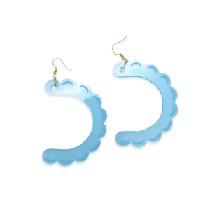 Studio-style shot of the Big Mouth Retainer Earrings on a transparent background, featuring blue acrylic earrings shaped like retainers.